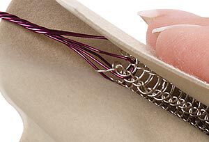 Knit tube being pulled through conditioning cloth